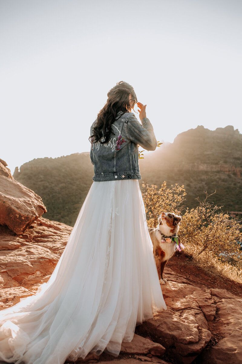 bride and her dog on their wedding day in sedona