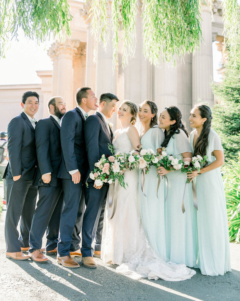 Candid of Bridal Party with Bride + Groom