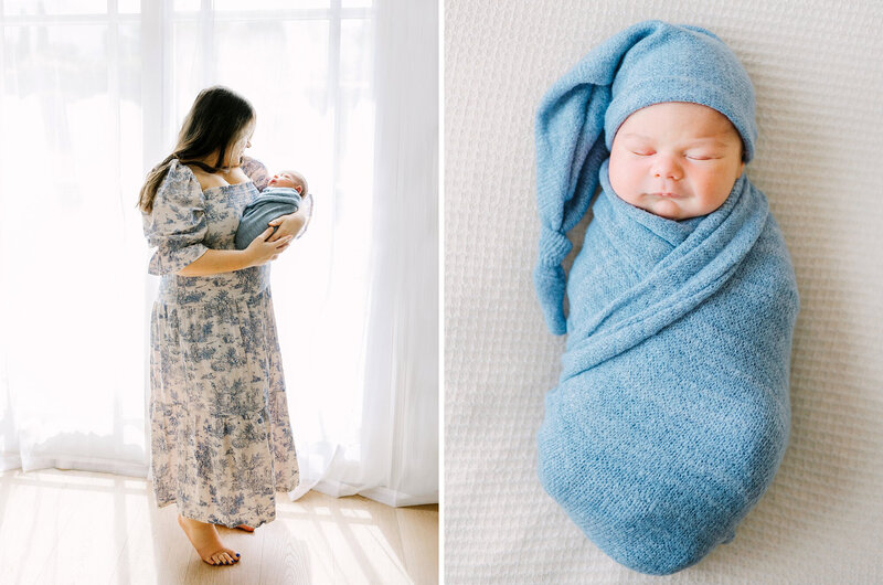 A mom in a floral print blue dress holding her newborn baby boy