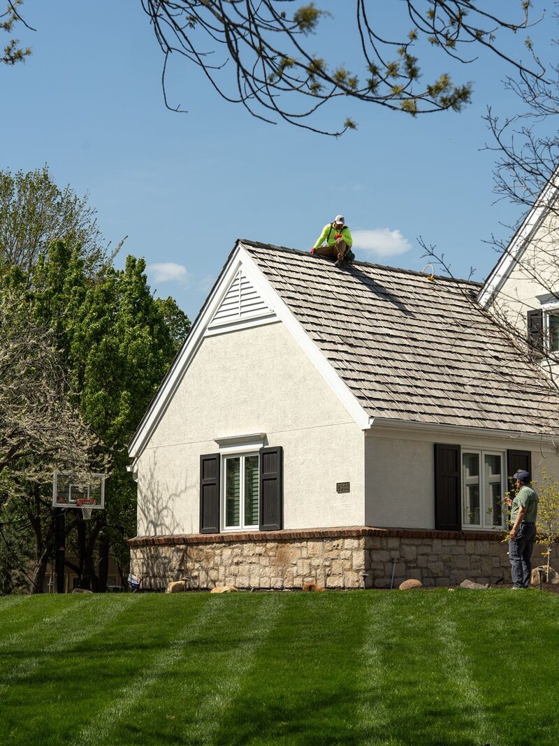 Kansas City roofing company conducting a structural, material, and interior inspection on a roof