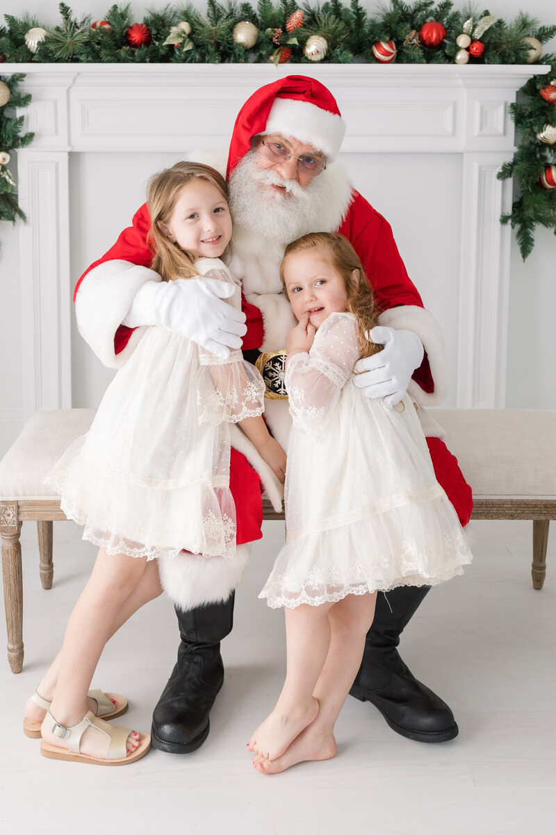 a boy smiling at Santa