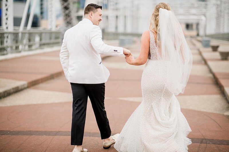 couple holding hands by Knoxville Wedding Photographer, Amanda May Photos