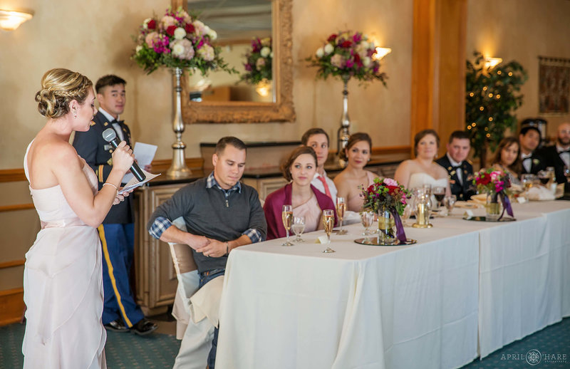 Toasts at indoor wedding reception at Briarhurst Manor Weddings