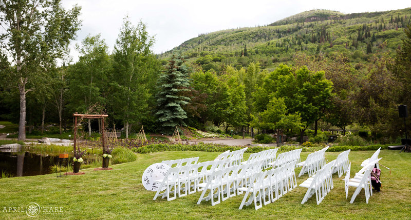 Yampa River Botanic Park set up for ceremony with white chairs during summer
