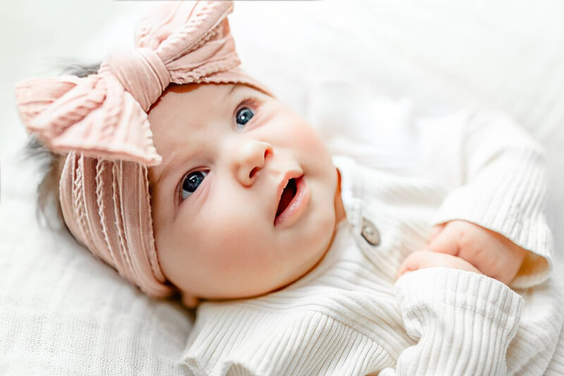 Baby girl captured at her luxury newborn session by Ann Arbor Newborn Photographer