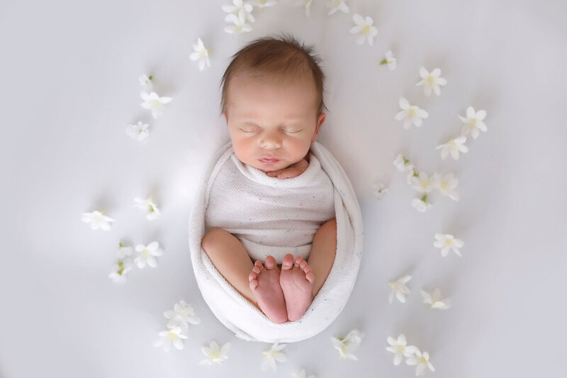 baby-girl-all-wrapped-up-in-white-for-her-newborn-shoot-at-8-days-old