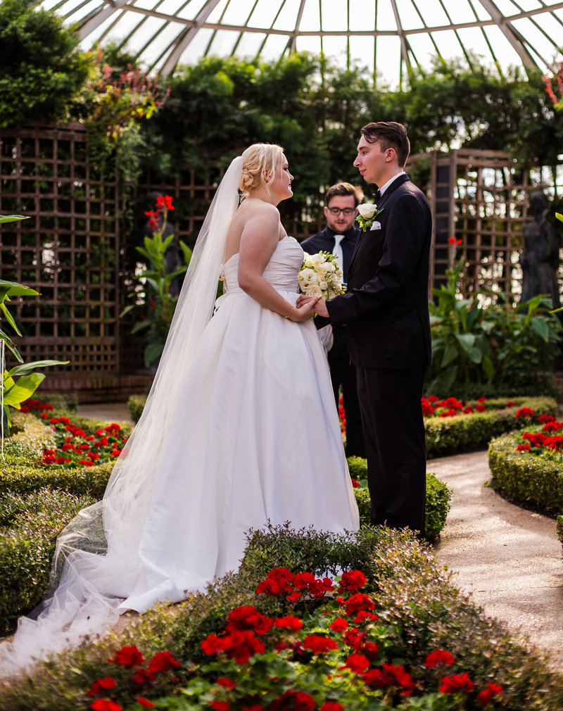 Bride and groom stand in front of officiant in Broderie Room for a Phipps Conservatory wedding