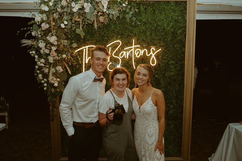 wedding photographer with the bride and groom