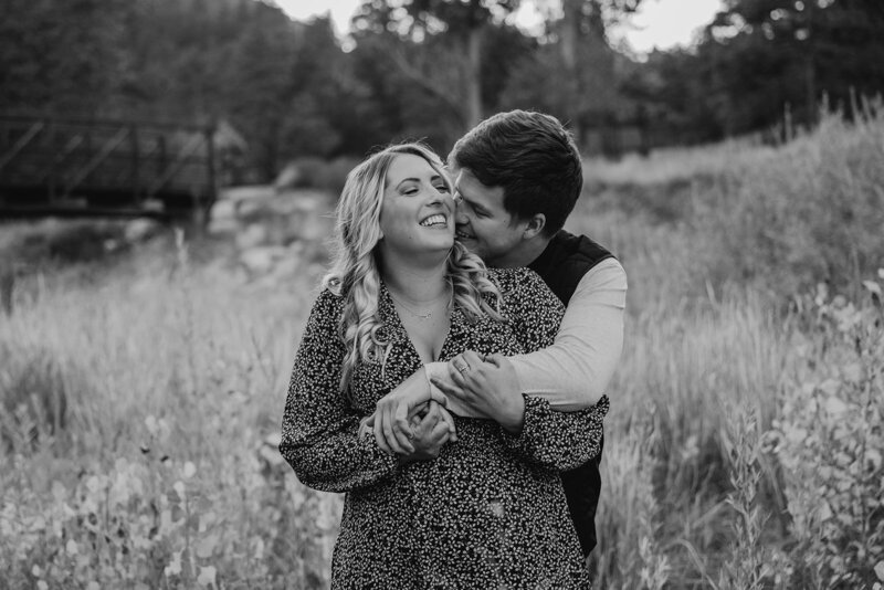 Couple smiles during their fall engagement photos