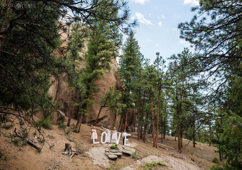 Summer elopement for two brides at Bucksnort Disc Golf in Pine Colorado
