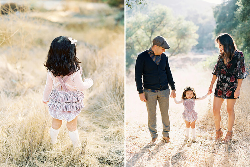 A family holds hands with their daughter in a golden field during a fall family portrait session