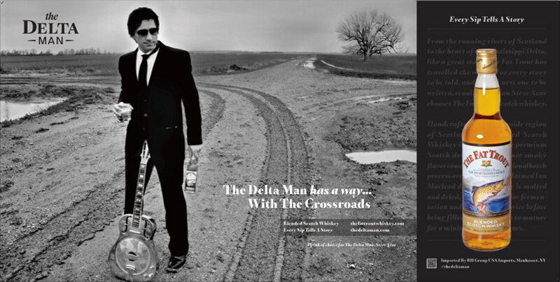Steve Azar The Delta Man standing at Crossroads Mississippi with guitar between his legs and whisky glass in hand branding photo