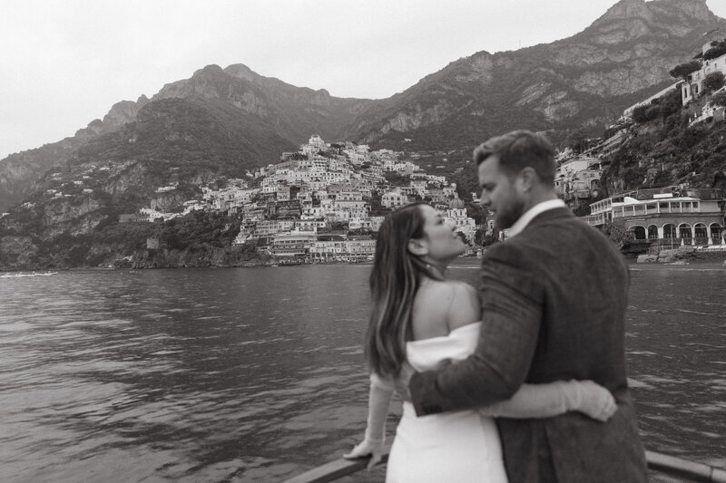 bride and groom in positano italy on a boat