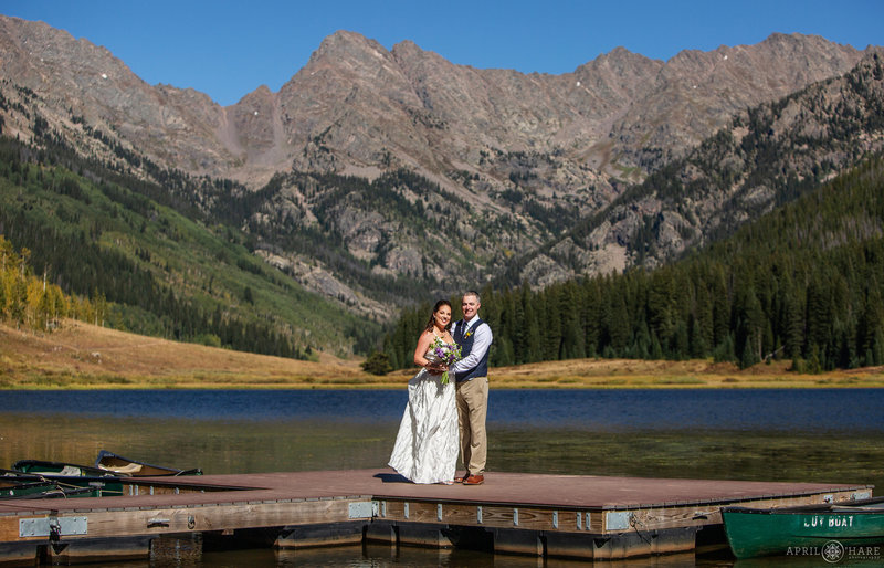 Bride and groom on the dock at Piney Lake