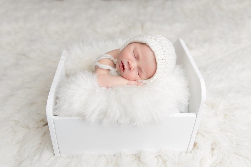 newborn white cradle bed