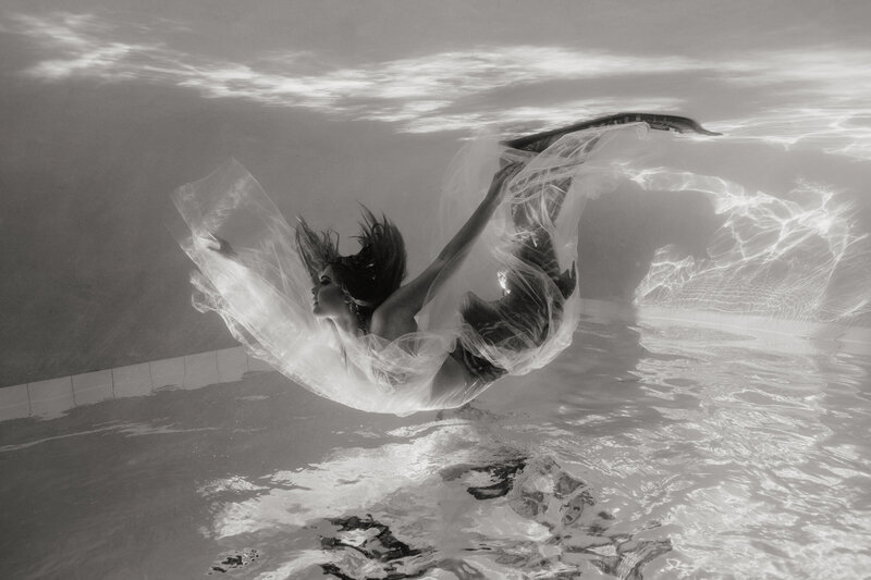 Underwater photoshoot of mermaid