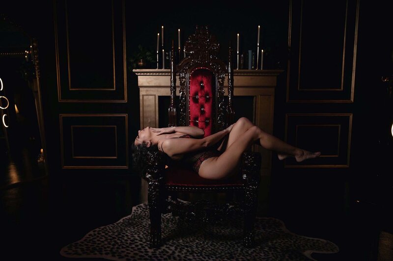 Brunette woman posing on throne