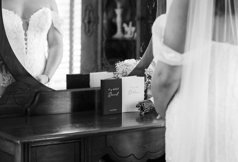Bride standing in front of the mirror before ceremony by Phavy, Wedding Photographer in St. Simons Island