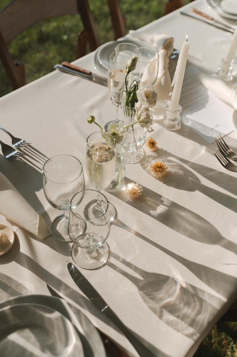sunlight coming through glassware on a wedding table setting