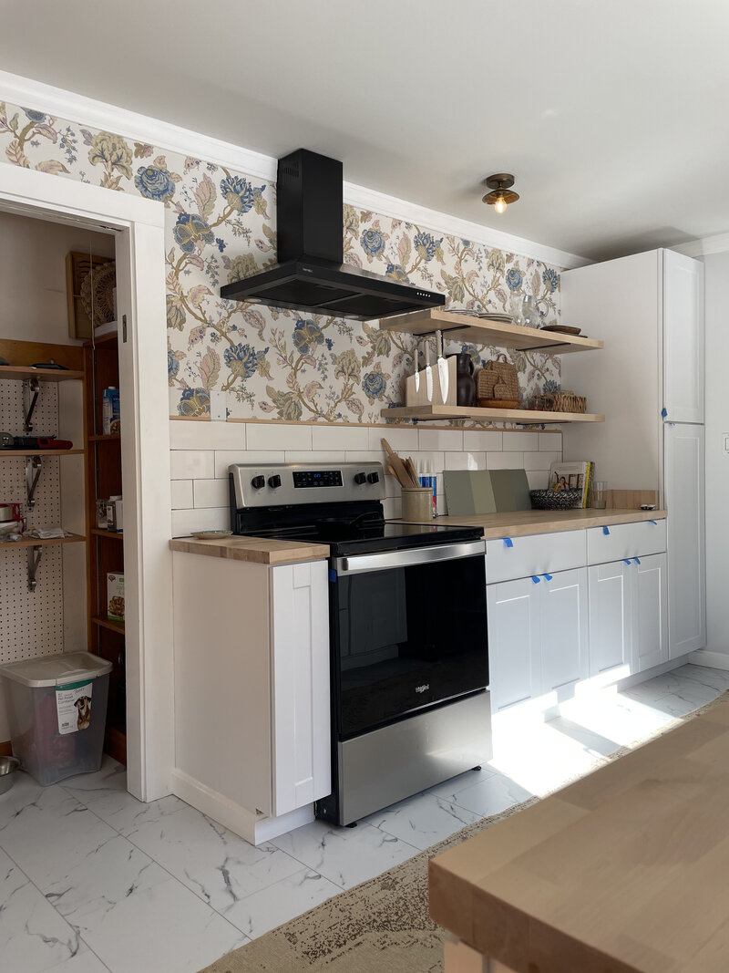 Laundry Room renovation by Nadine Stay. Rustic dark wood walls with basketweave brick floors. Brown door paint color. Mudroom built in cabinets.