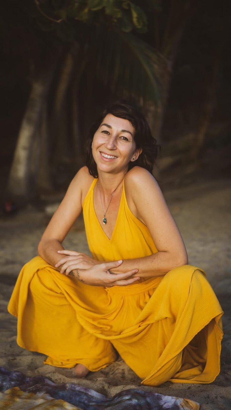 Flo, a French yoga teacher and sound healer, leading spiritual ceremonies and yoga sessions in Puerto Escondido, Mexico.