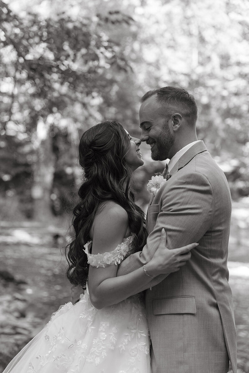 bride and groom touch noses during portraits after wedding in lancaster pa