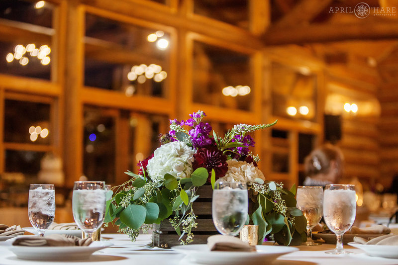 Beautiful floral table centerpiece from an Evergreen Lake House wedding in Colorado