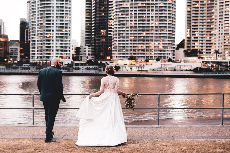 Wedding couple looking at the buildings of Brisbane City