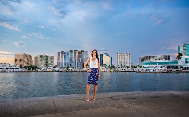 A realtor at Bayfront Park with downtown Sarasota in the background across the water