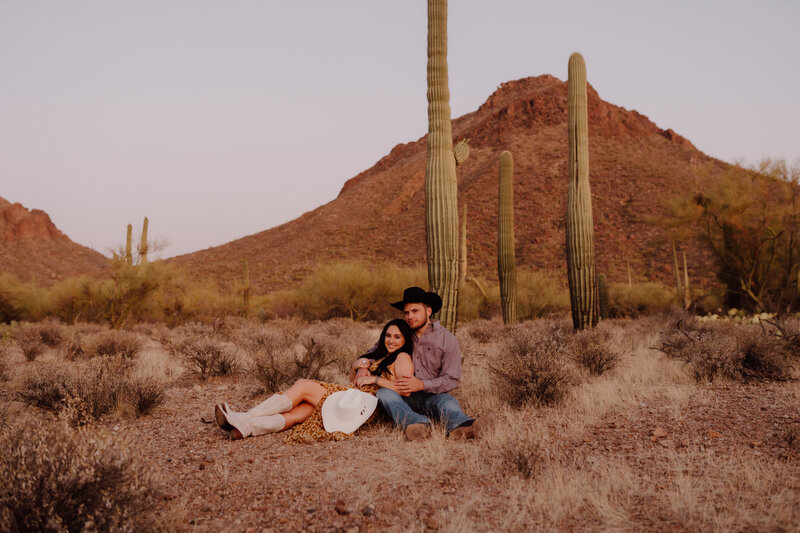couple posing by cactus
