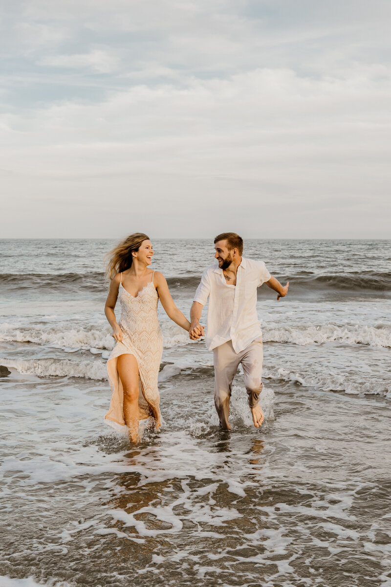 Romantic Engagement and Couple photography on the beach in Hilton Head by Lisa Staff Photography running through the water