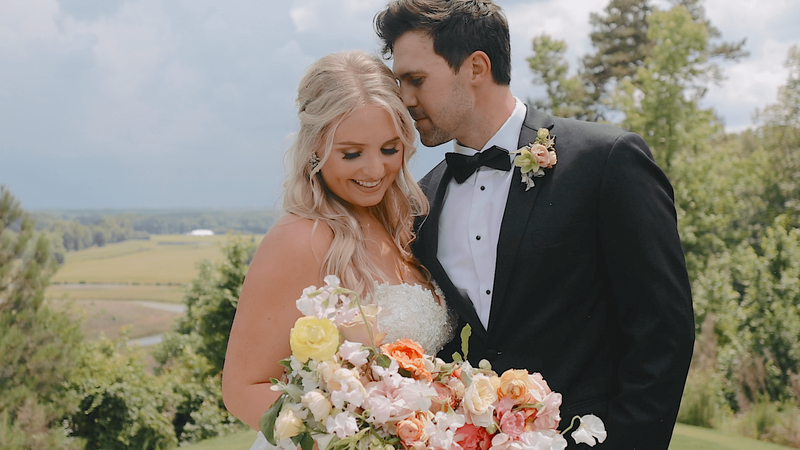 Bride and groom pose together after getting married in Georgia with florals