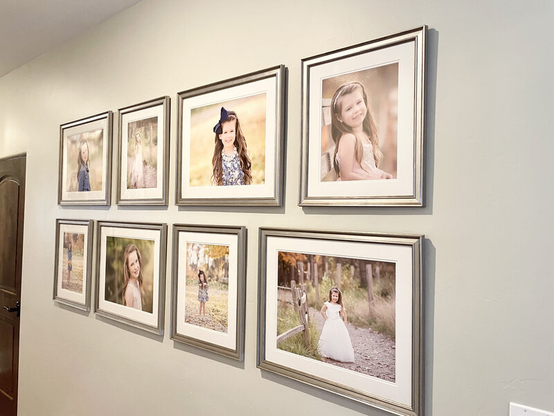 Wall gallery of family photos from Tiffany Hix Photography in Eagle home