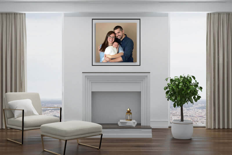 first family image hung over fireplace