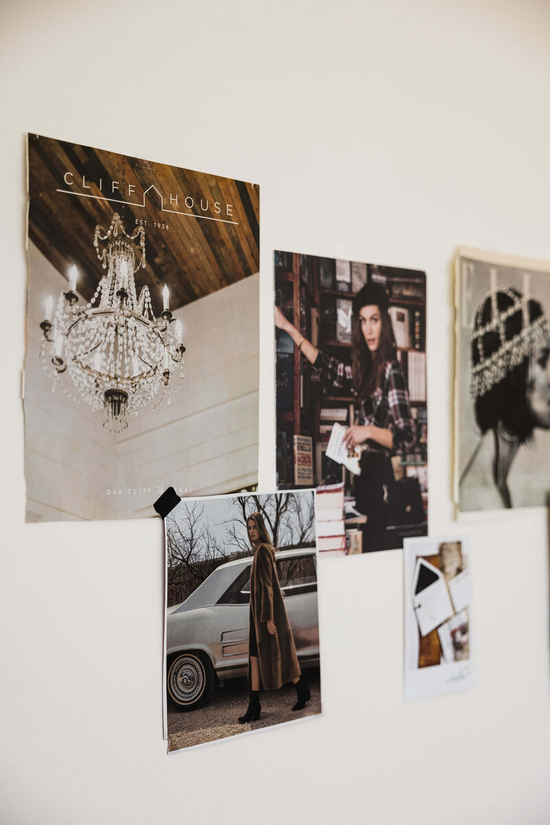 Moodboard of photographs and pages taped to a wall