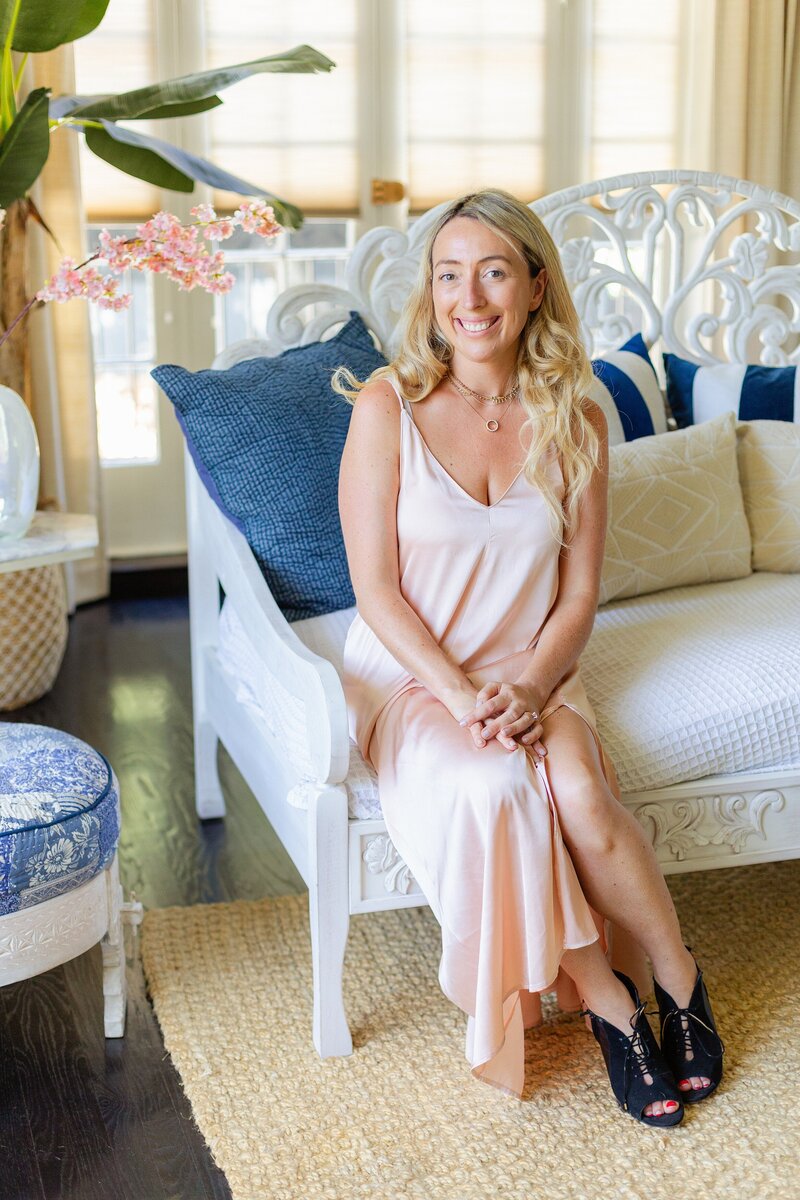 female mindset coach poses for brand portrait at her luxury home in Pasadena