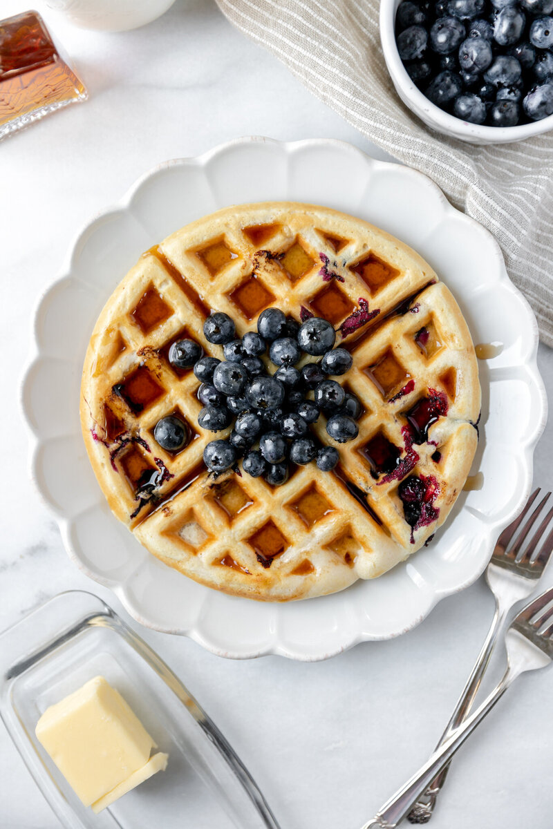 a waffle topped with blueberries