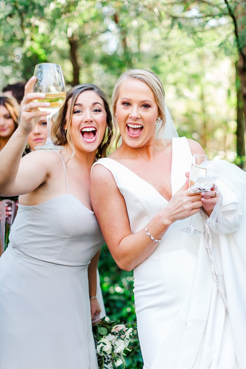 bride and bridesmaid celebrating by Knoxville Wedding Photographer, Amanda May Photos