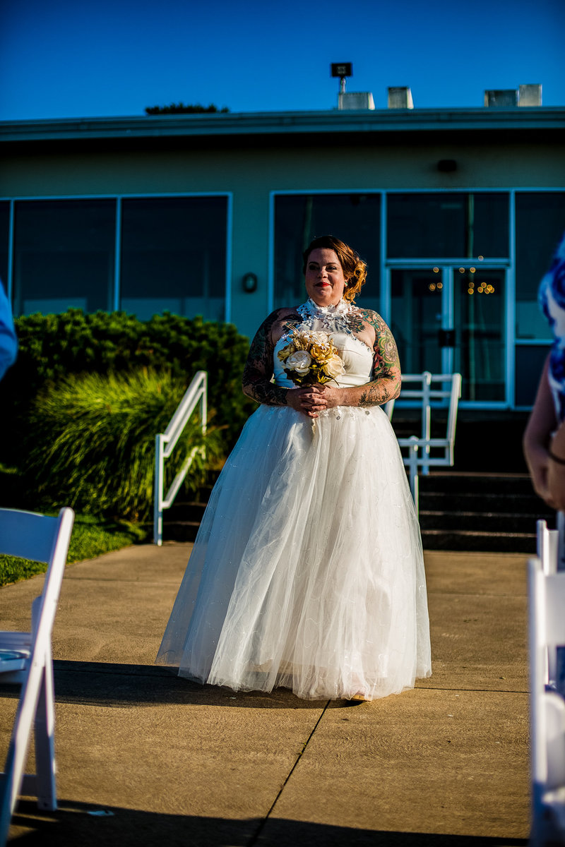Bride processing to ceremony site at the Erie Yacht Club