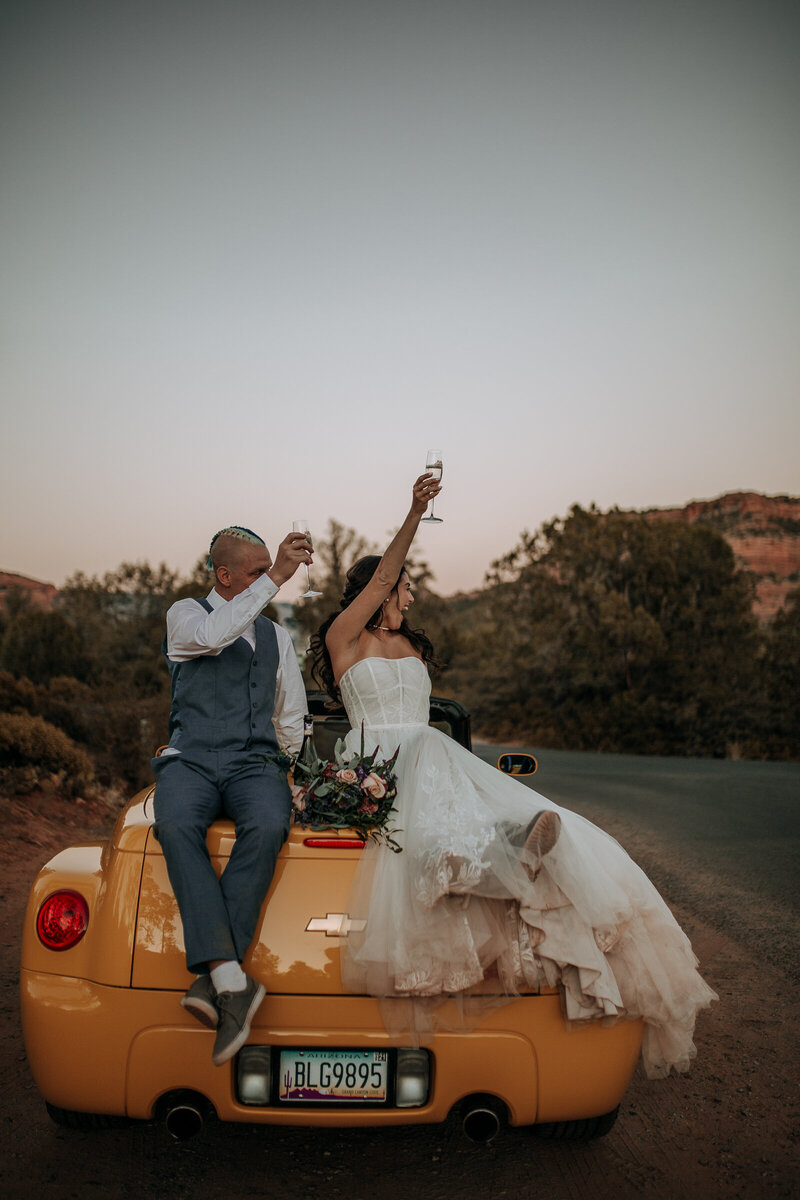 yellow convertible getaway car  at their wedding in sedona