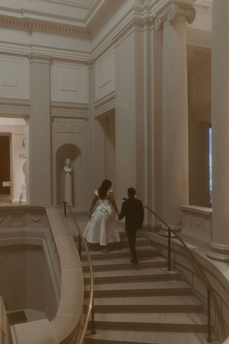 a couple in a museum for their city elopement photos