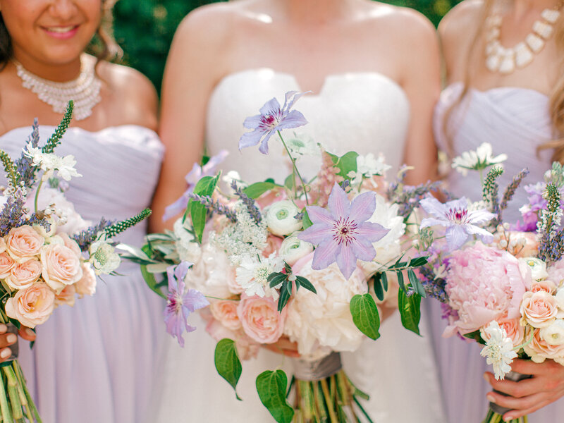 lavender bridesmaid dresses and pastel bouquets