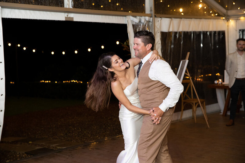 Bride and dad enjoyably dance at wedding reception
