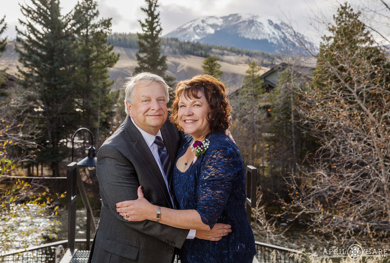 Wedding portrait with pretty mountain view from the Bridge at Silverthorne Pavilion in Colorado