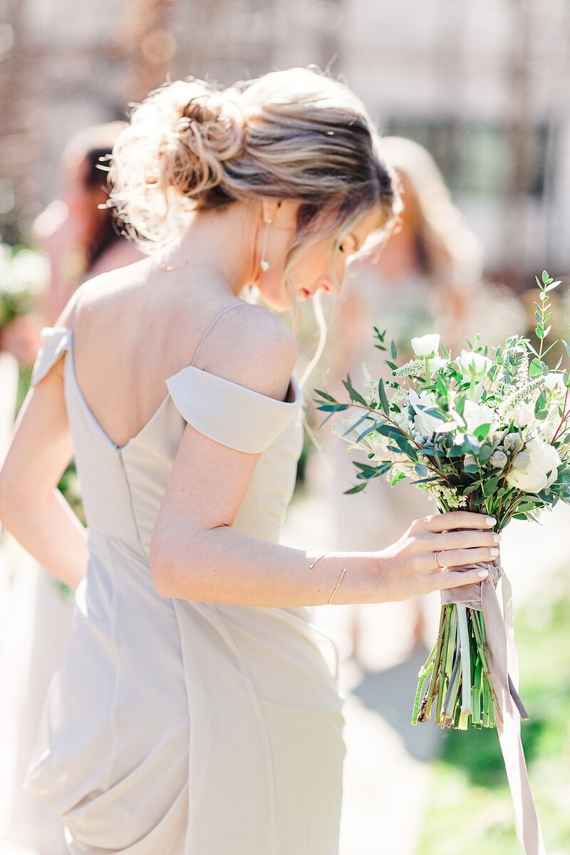 bridesmaid holding bouquet by Knoxville Wedding Photographer, Amanda May Photos