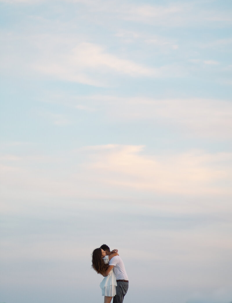 Romantic engagement photo at blue hour at Cape Henlopen DE