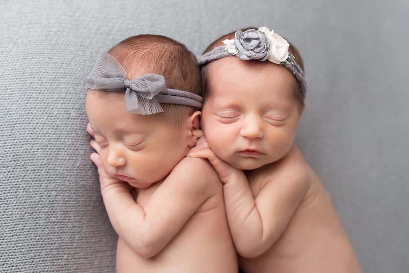 twin newborn girls with grey