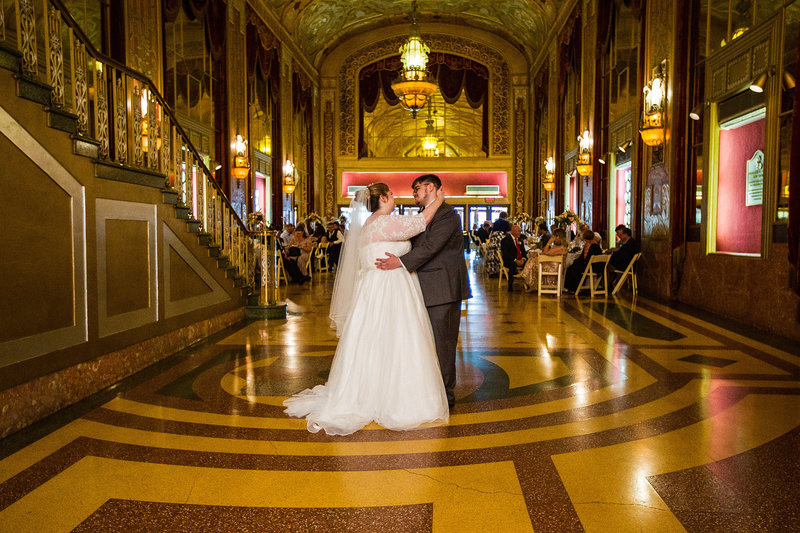 Bride and groom dance at the Warner Theatre in Downtown Erie, PA