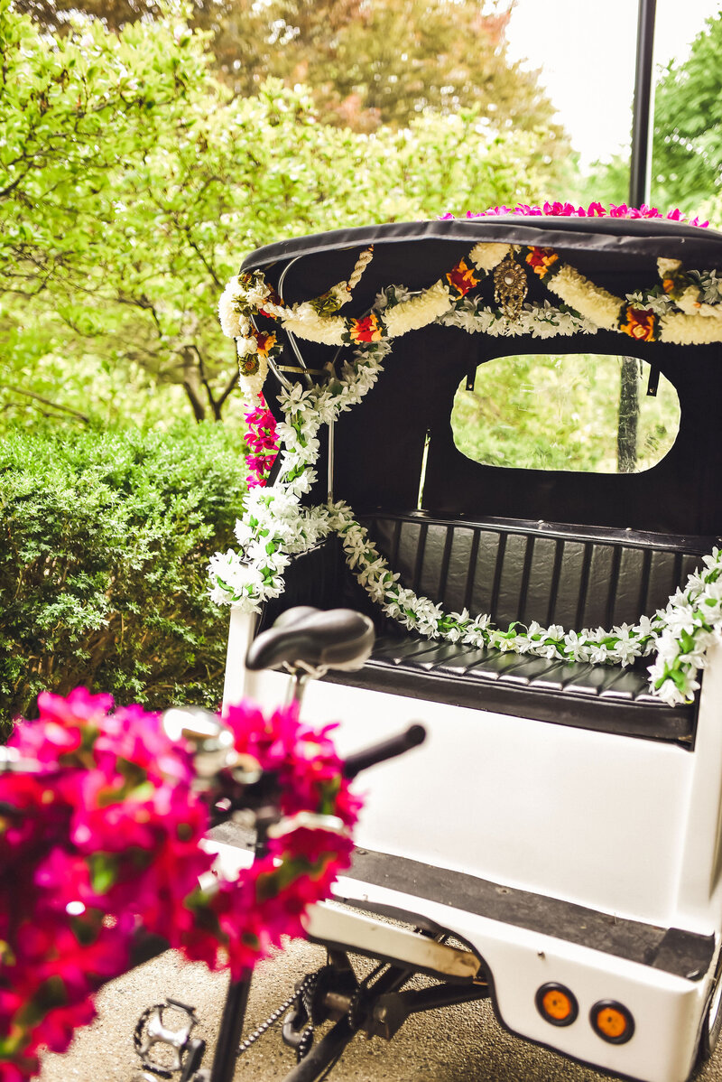Wedding car decorated with pink flowers