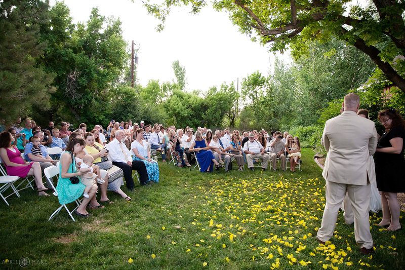 Wedding guests on the lawn next to barn at Chatfield Farms Denver Botanic Gardens